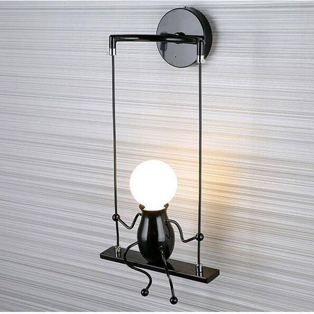 Zyrelia | Contemporary Swinging Figure Metal Wall Light Fixture